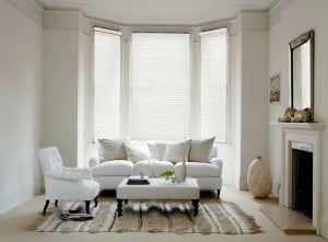 white painted wooden venetian blinds with cords